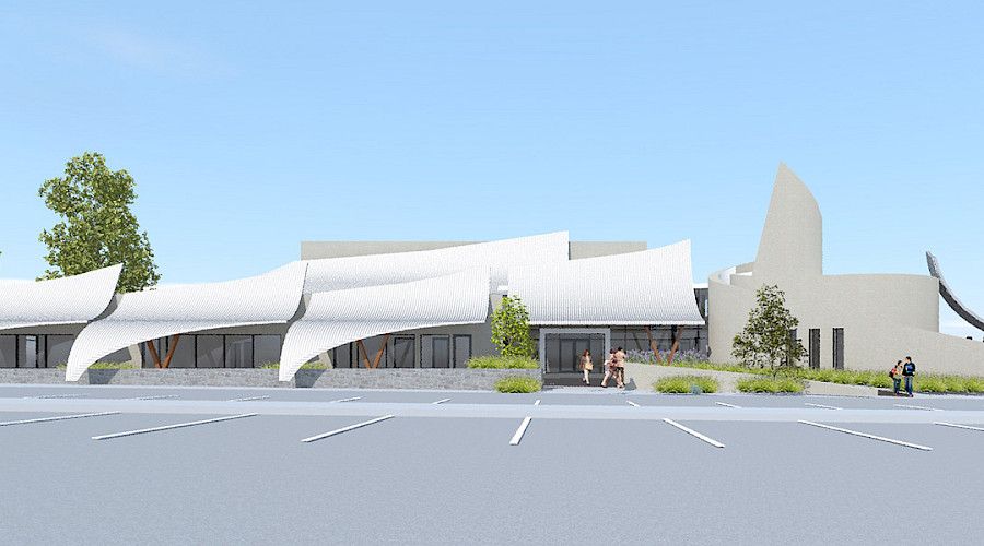 Exterior rendering image of the back of the new OKIB Cultural Immersion School including the parking lot and drop off spot