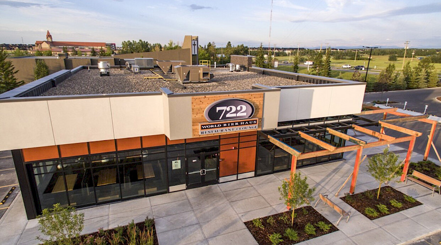 An aerial shot of the Springbank Retail building with a large sign above an entrance that reads 