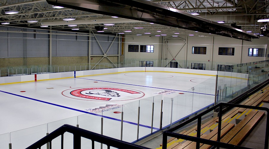 Bleachers overlooking a hockey rink.