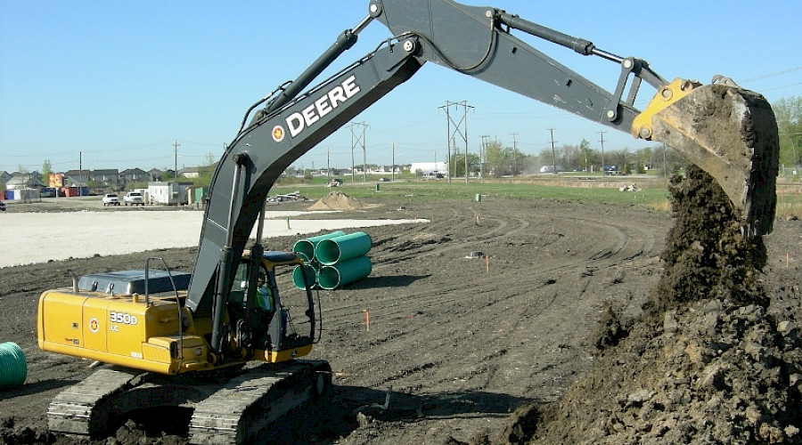 An excavator at work on a construction site.