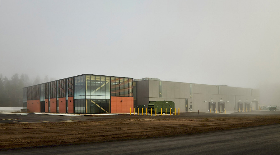The exterior of the Canadian Nuclear Laboratories building on a grey, foggy day.