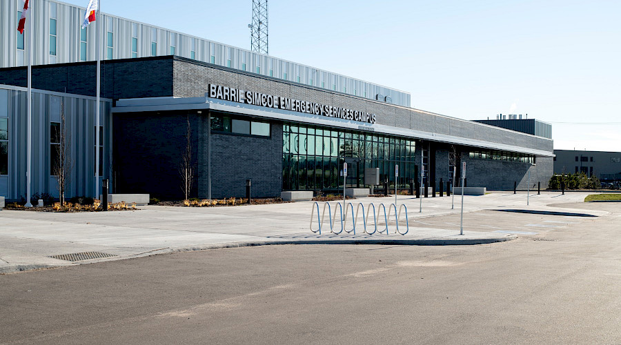 The parking lot in front of the exterior of the Barrie Simcoe Emergency Services campus.