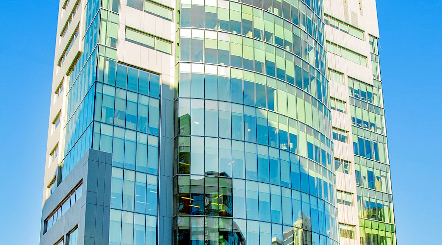 The sun reflecting off the glass windows on the WSP Place building.