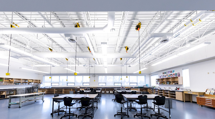 A large classroom filled with desks and chairs.