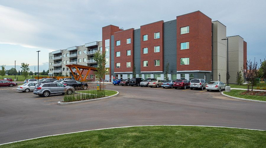 A photo of the parking lot in front of the Sakaw Terrace Senior Housing.