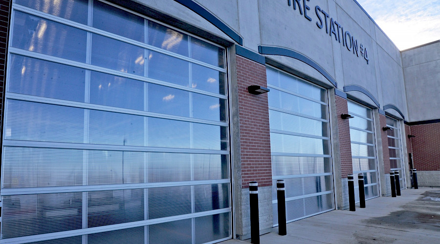 Rows of full-view garage doors from the outside of the Red Deer Fire Station.