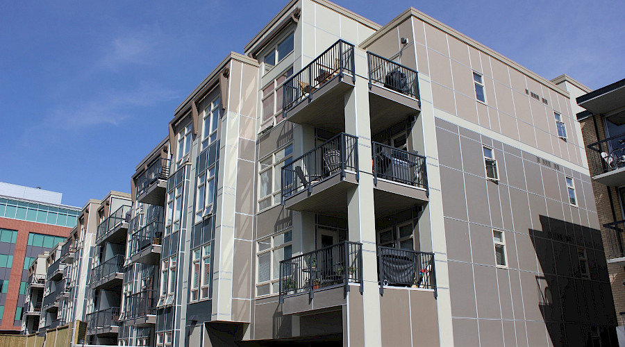 A photo of the exterior of the Tribeca Condominium building.