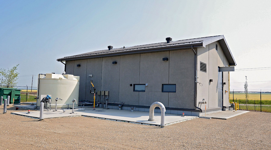 The exterior of a building behind a water tank.