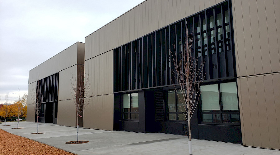 The grey and black exterior of the Maple Grove Elementary school.