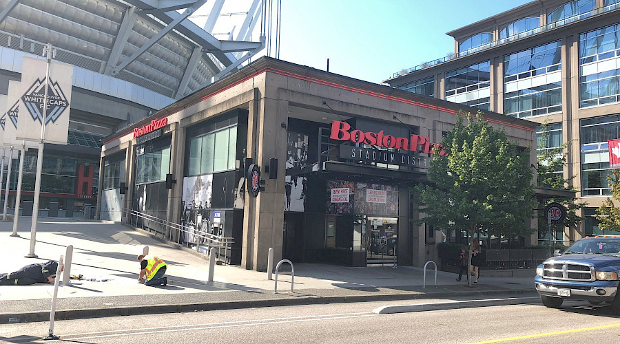 A photo of the exterior of the Stadium Boston Pizza.