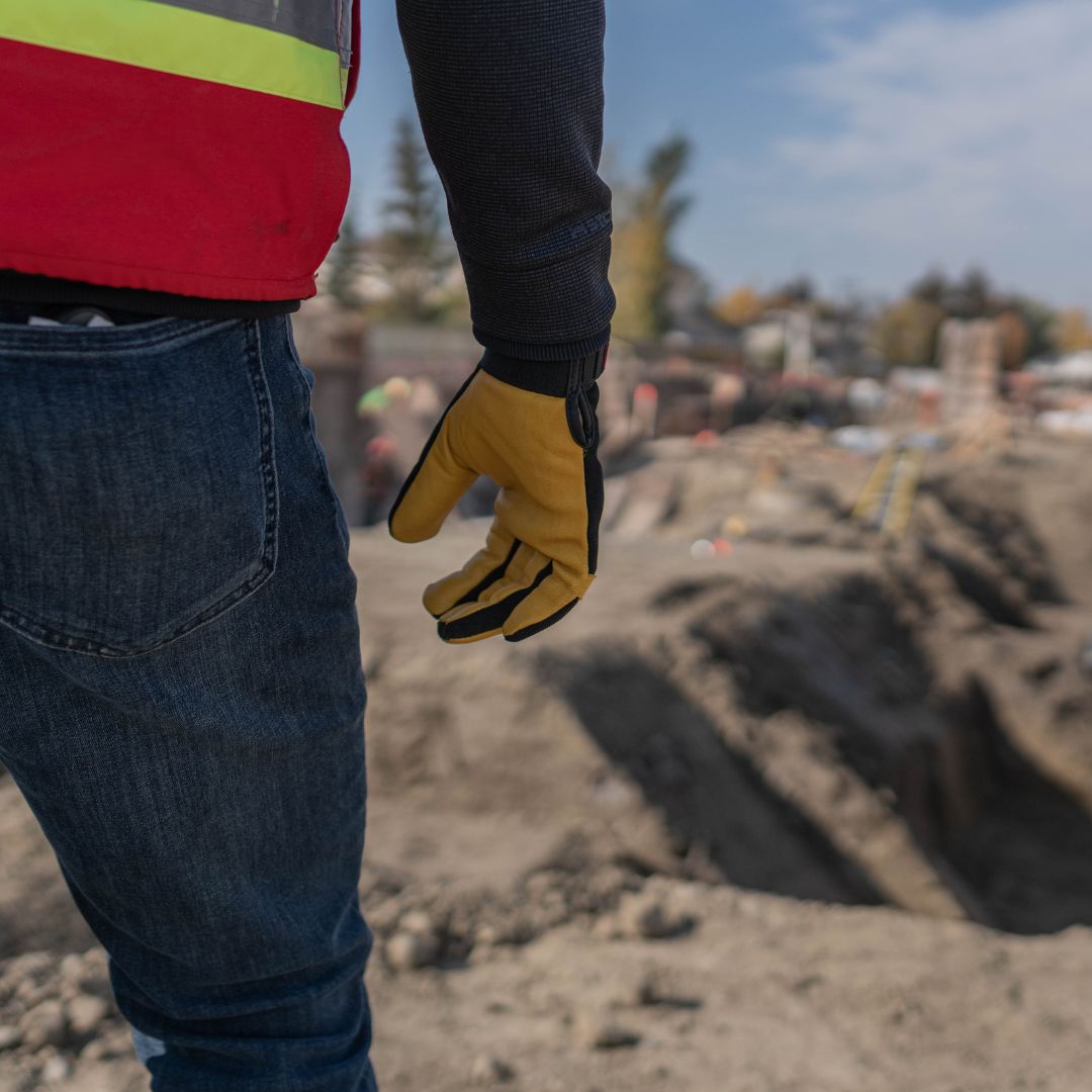 Three Chandos construction workers discussing a project on site.