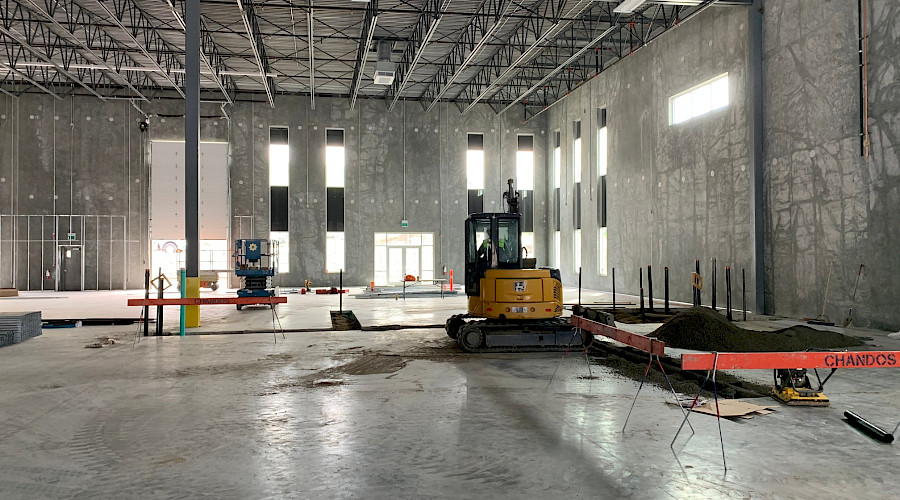The interior of a manufacturing facility under construction.