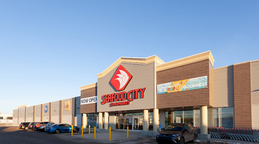 A photo of the exterior of Seafood City featuring it's large red signage.