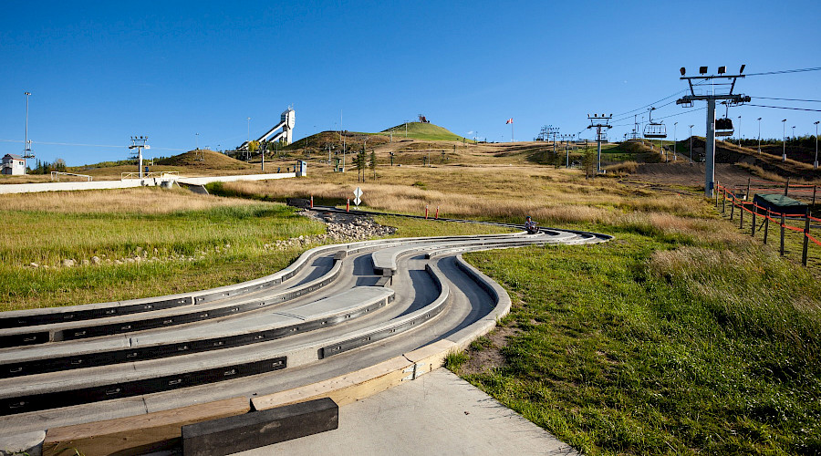 A person on the tracks of the luge track at the Canada Olympic park.