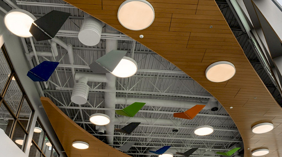 A photo of the library at Davidson Creek school, showcasing it's timber ceiling and potlights.