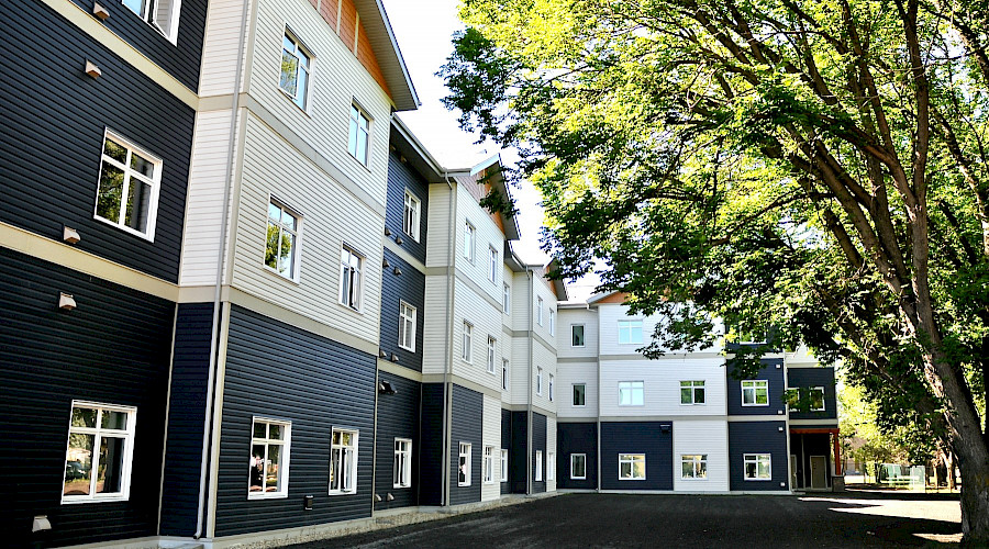 A photo of the exterior of the Crimson Villas senior housing buildings.