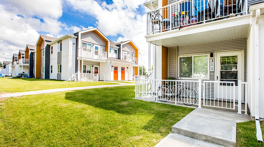 A photo of a deck on a property in Linsford Place, with multiple other housing buildings in the background.