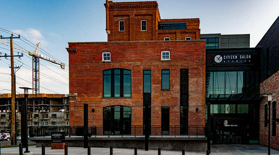 The black and brick exterior of the Molson Tower in Edmonton's historic Brewery District.