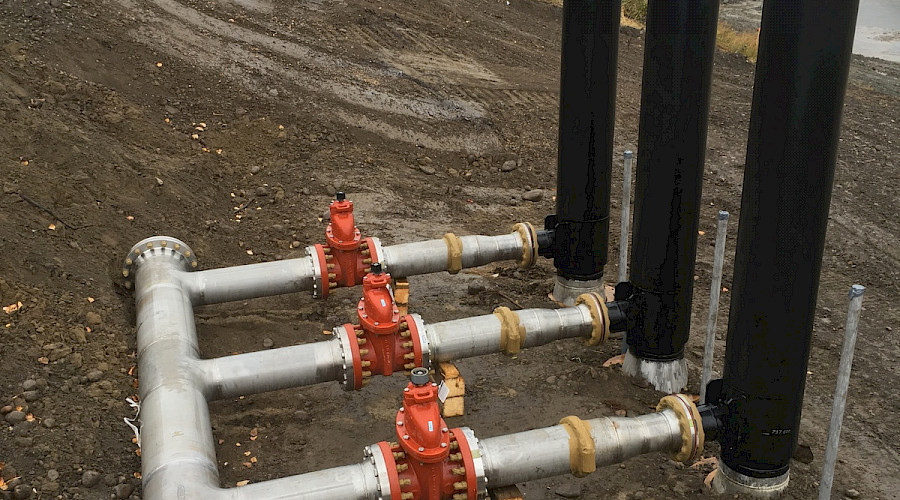 Pipes in the ground on a construction site.