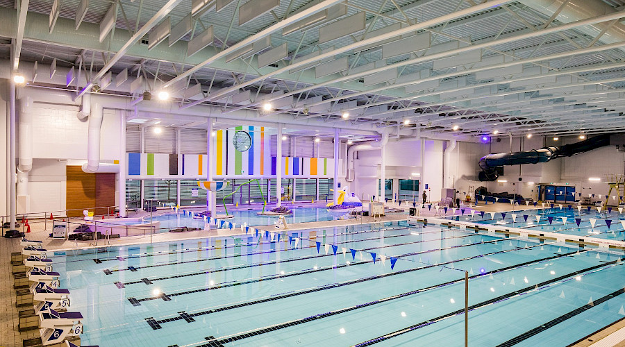 A shot from above of a large pool with multiple lanes.