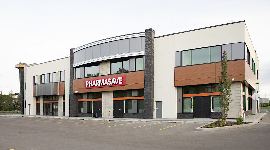 A large building with a bright red sign that reads 