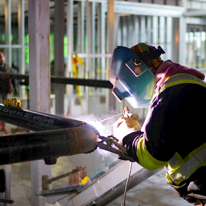 A Chandos welder working on site.