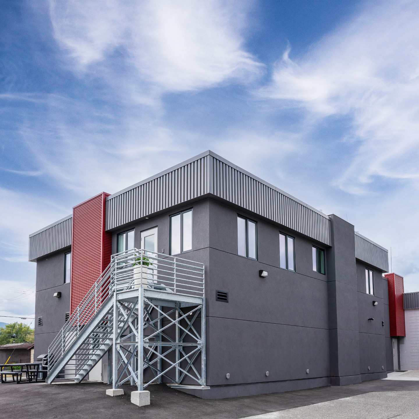 A picture of the Merritt Firehall expansion project with a blue sky in the background.