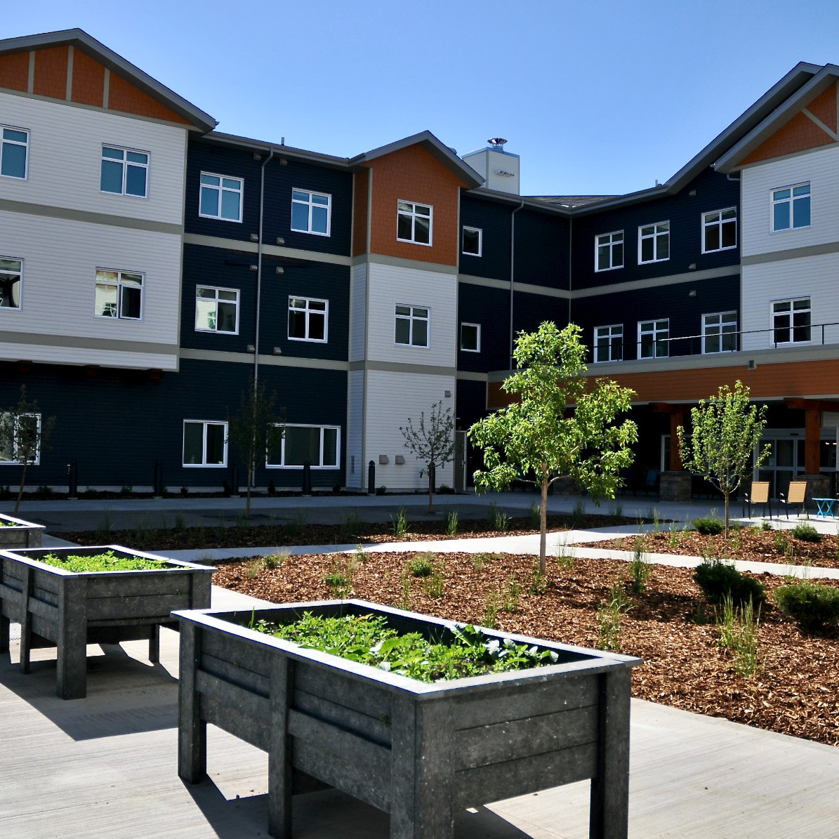 A photo of the black and white exterior of the Crimson Villas in Red Deer, Alberta.