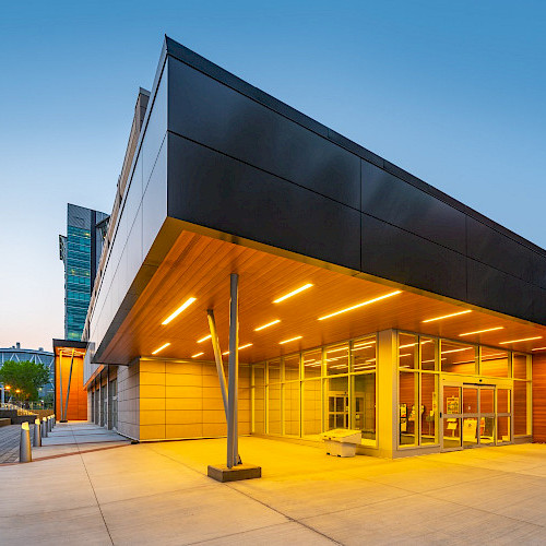 A corner of the John Ware building at the SAIT campus in Calgary, Alberta, lit up at night.