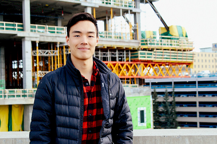 A Chandos construction worker smiling at the camera on a project site.