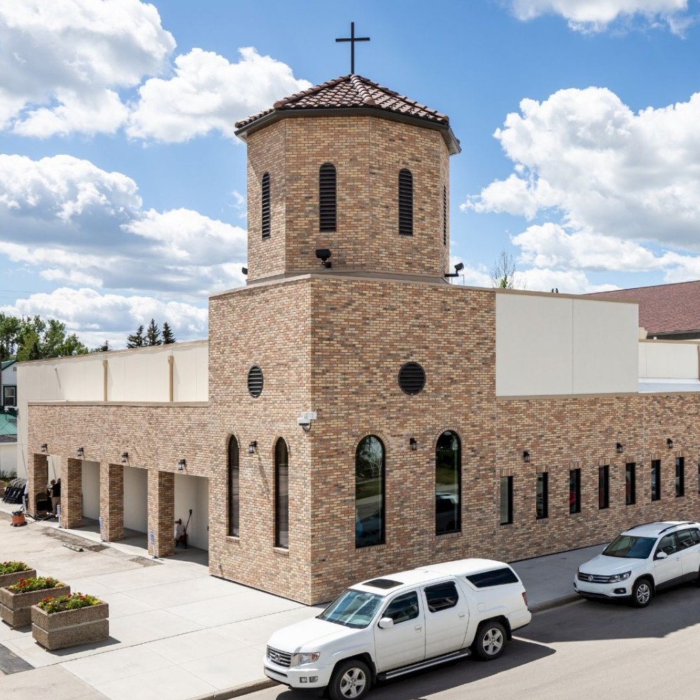 Image of exterior of the new Sacred Heart Parish, which was formerly an IGA. The Chandos Construction SSG team renovated it, and found sustainability savings.
