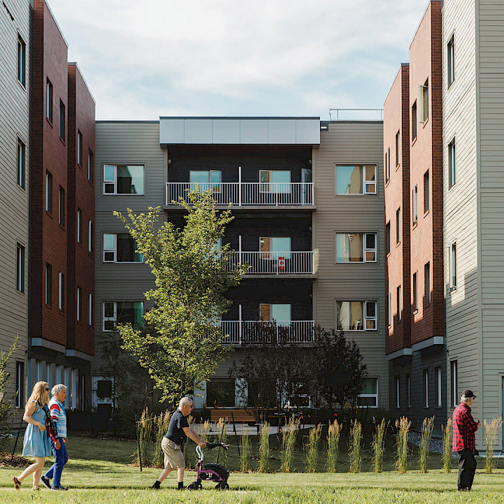 Seniors walking outside of Sakaw Terrace in Red Deer Alberta, it is the first of its kind.
