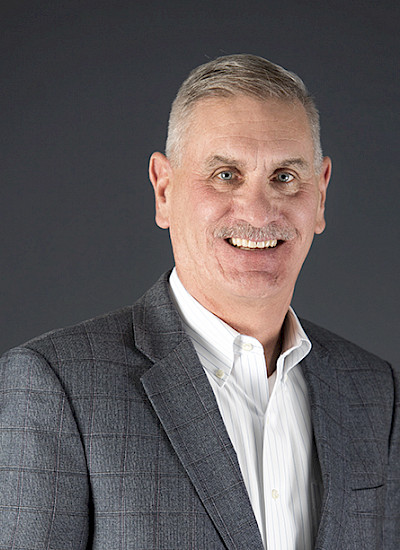 A headshot of Bill Hughes.
