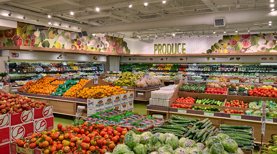 Rows of colourful fresh produce in a supermarket.