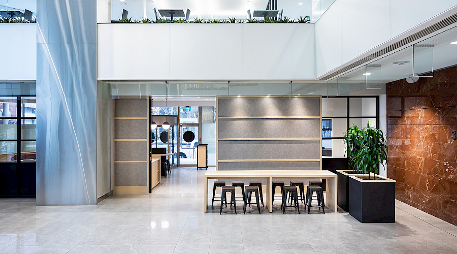 Foyer view of Seed n Salt with light oak furniture and wall fixtures.