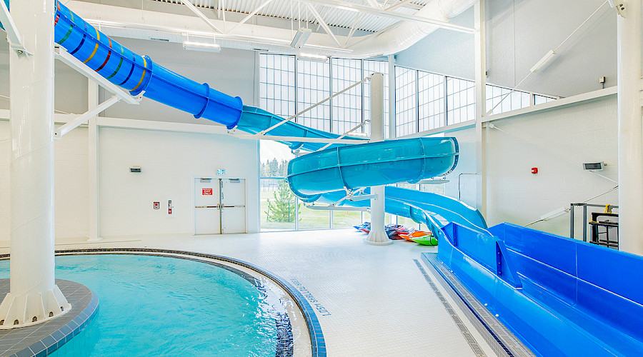 Image of the new pool at Ricochet Oil Corp Aquatic Centre built by Chandos Construciton featuring the waterslide