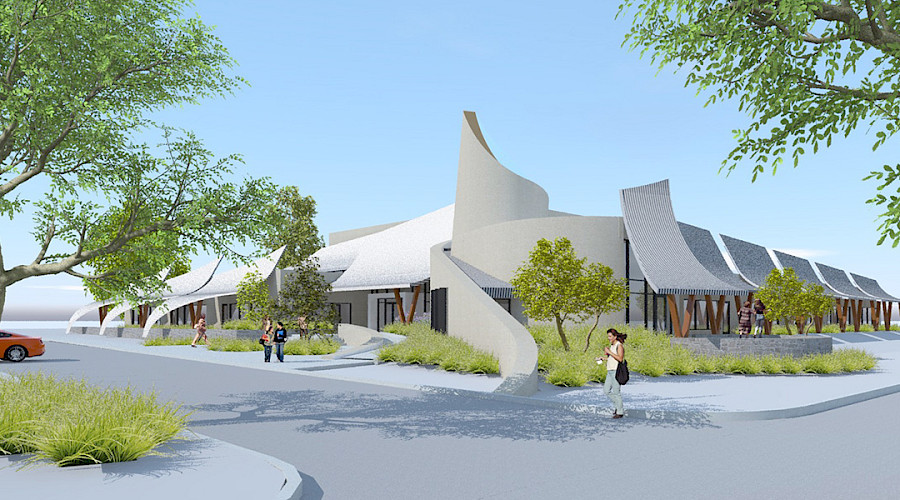 Rendering image of the exterior of the OKIB Cultural Immersion School, featuring a new parking lot, native landscaping, and the mixed use areas of the school.