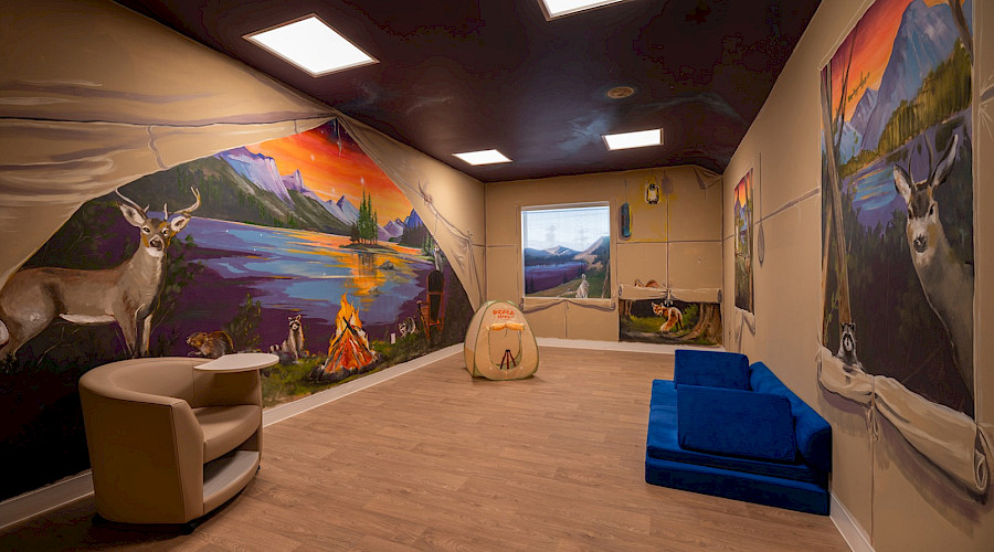 Image of a family support room decorated with inspirations of natural habitats and Indigenous influences built by Chandos Construction Calgary