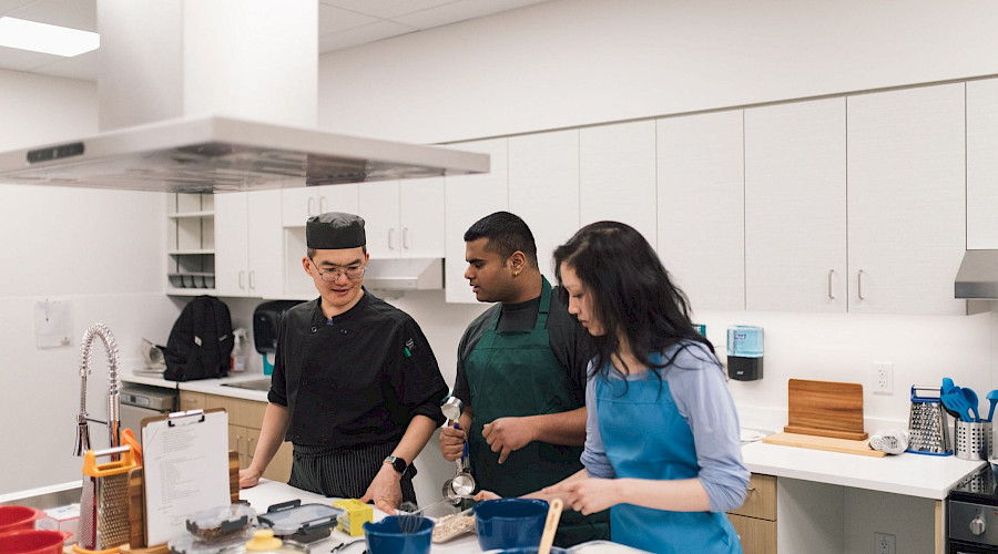 Interior shot of the Covenant House Vancouver teaching kitchen for residents to learn life skills, built by Chandos Construction Vancouver