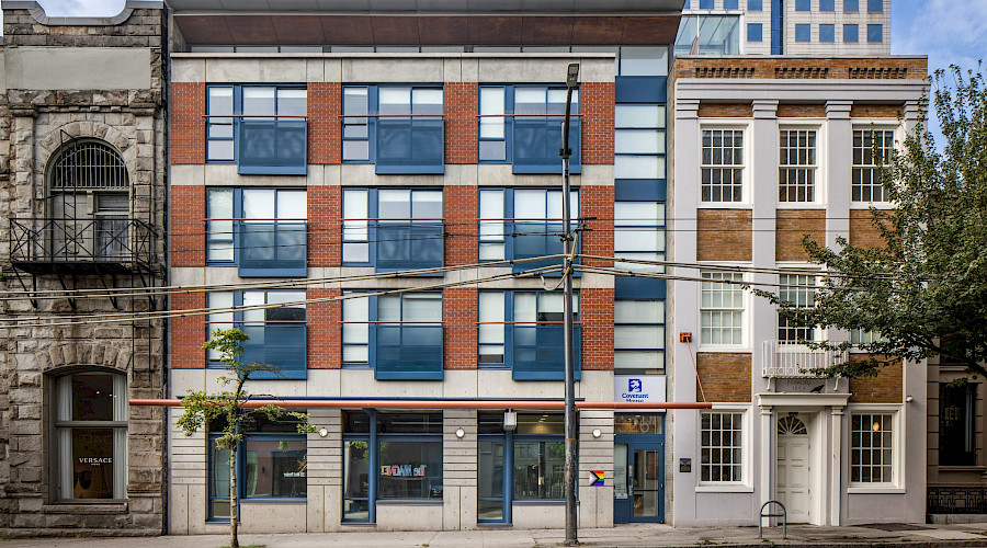 Exterior image of the Covenant House Vancouver with updated windows, cladding, and doors built by Chandos Construction Vancouver