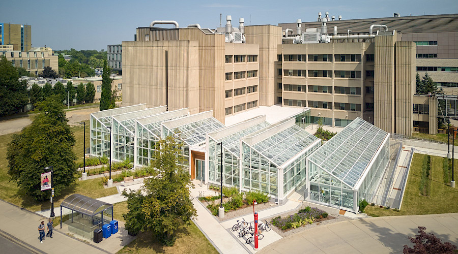Exterior drone shot of the new McMaster Greenhouse and renovated Life Sciences Building in Hamilton, Ontario, built by Chandos Construction Toronto