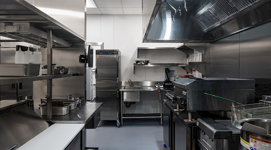 Interior image of the new Plaza Premium Lounge in YVR built by Chandos Construction Vancouver. Image showcases the commercial kitchen.
