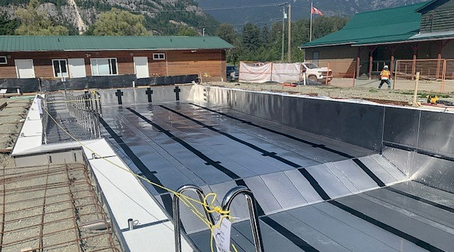 Exterior image of the new Bella Coola Centennial stainless steel pool built by Chandos Construction Vancouver.